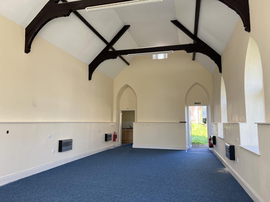 Lot: 26 - FORMER CHURCH WITH PLANNING PERMISSION FOR CONVERSION AND VACANT HALL - Inside of church looking to kitchen room at rear and rear entrance door